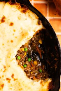 close up of healthy beef and lentil cottage pie with a scoop taken out