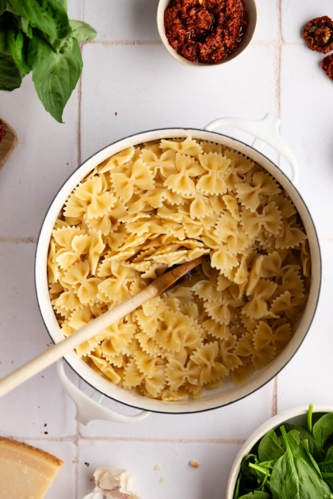 cooking the pasta al dente for the sun dried tomato pesto pasta