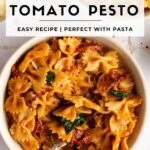 Pinterest image with bowl of sun dried pesto and working that reads the best sun dried tomato pesto