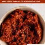 Pinterest image with bowl of sun dried pesto and working that reads the best sun dried tomato pesto