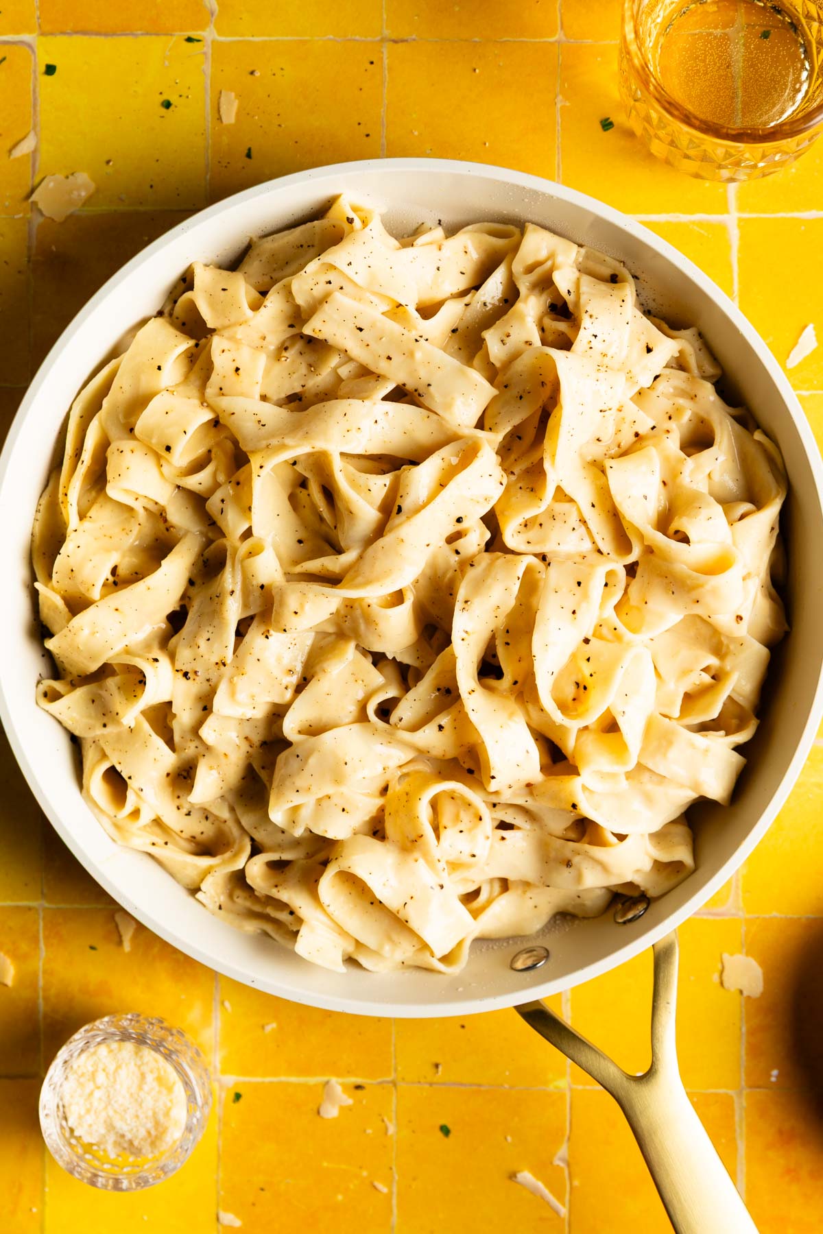 overhead photo of a pan of pasta coated in a creamy chickpea pasta sauce