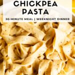 Close-up of creamy chickpea pasta sauce coating fettuccine noodles in a white pan