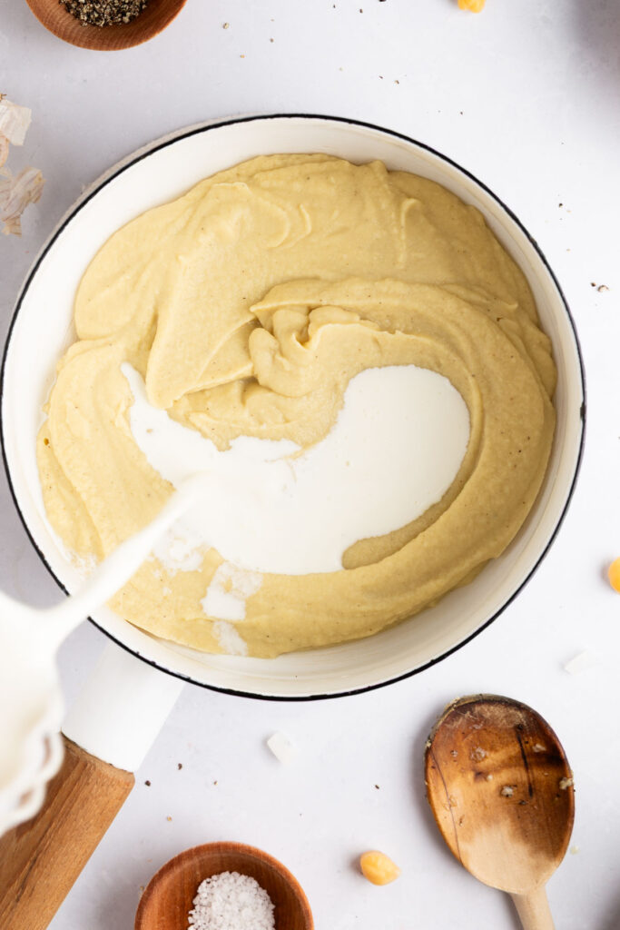 stirring in the cream to make it smooth