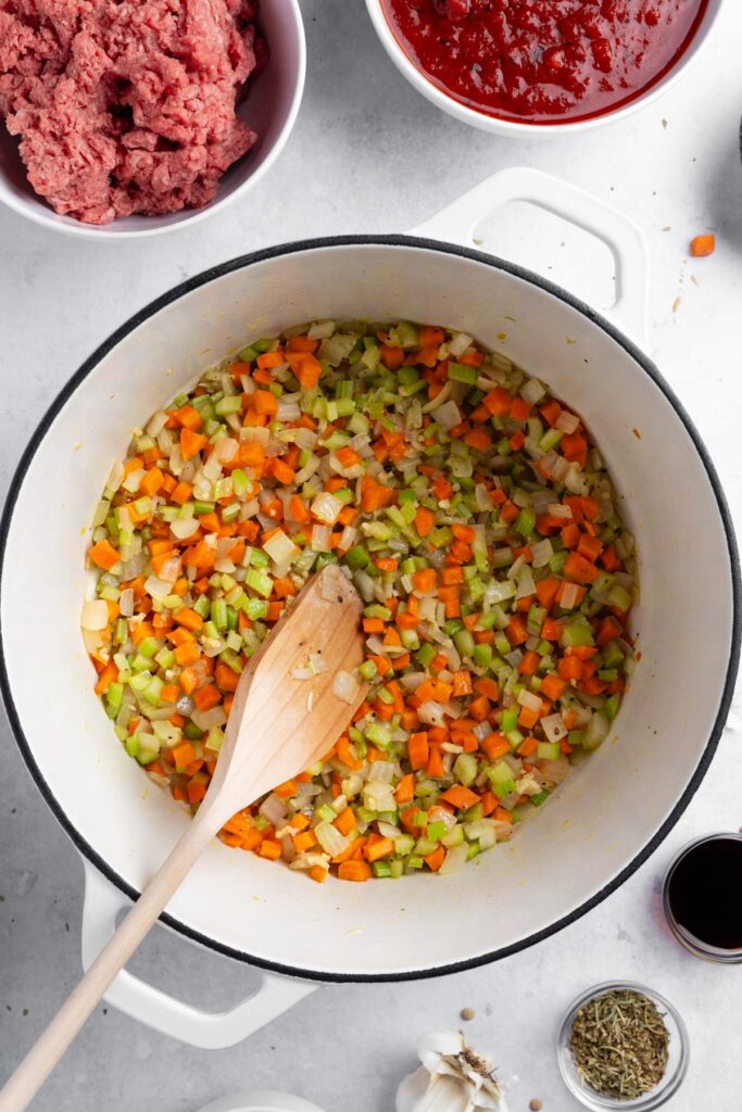 Sauting aromatics in olive oil until soft