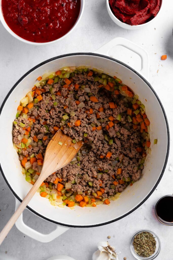 adding ground meat and cooking