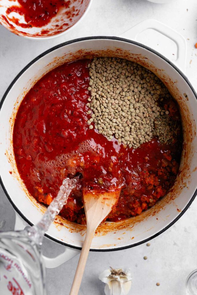 stirring in tomato paste