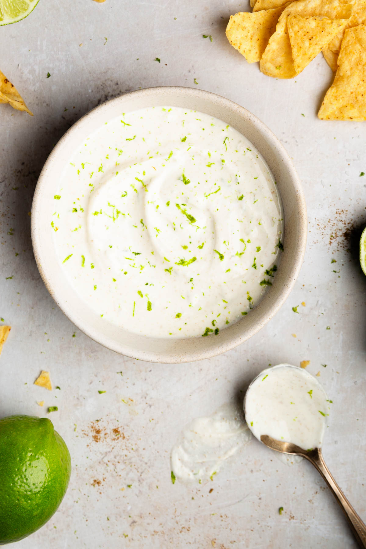 white bowl full of lime crema recipe.