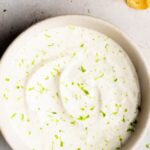 White bowl full of lime creme sauce