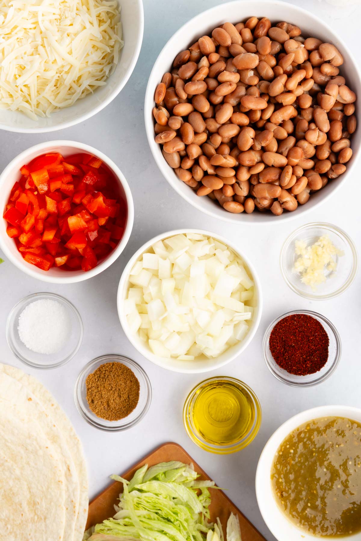 Ingredients needed to make Cheesy Pinto Bean Burritos. 