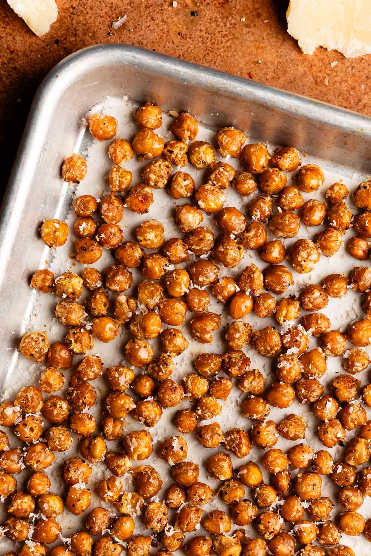 Baking sheet full of crispy chickpeas with Parmesan.