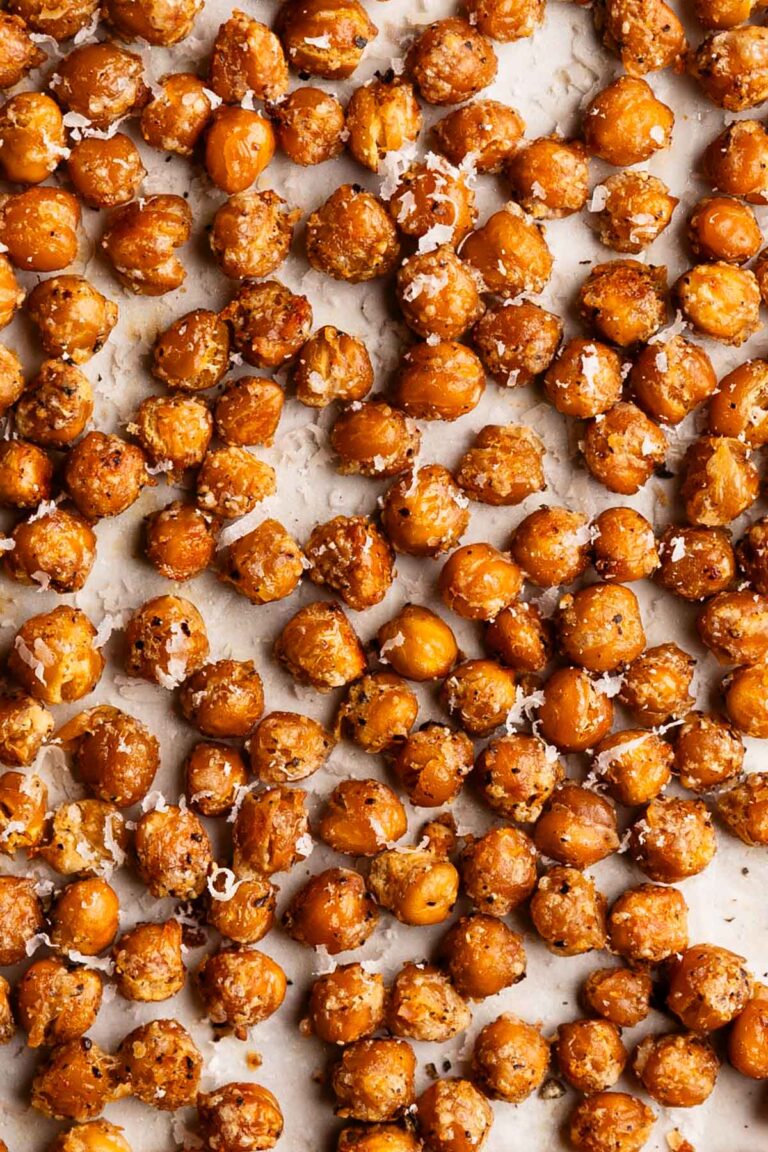 Close up of Parmesan roasted chickpeas on a baking sheet.