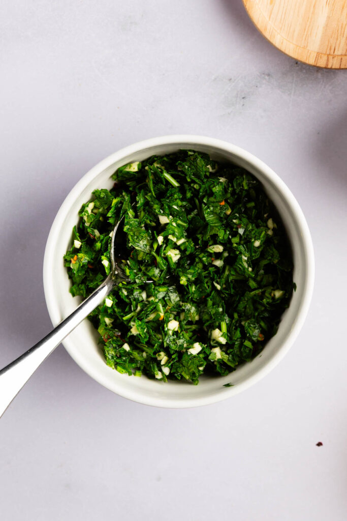 Adding all the parsley garlic sauce ingredients to a bowl.