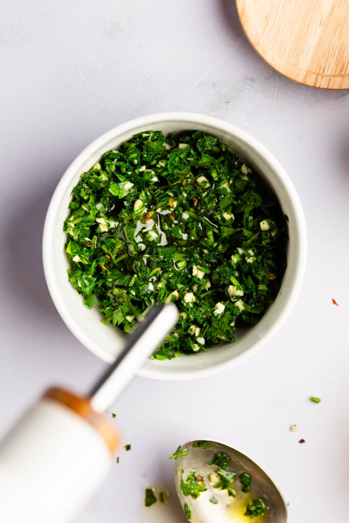 Adding the olive oil for the parsley garlic sauce. 