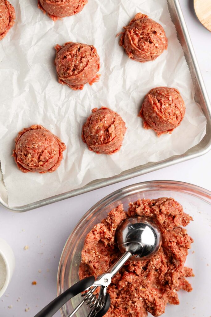 Scooping out the meat to make the beef meatballs with lentils. 
