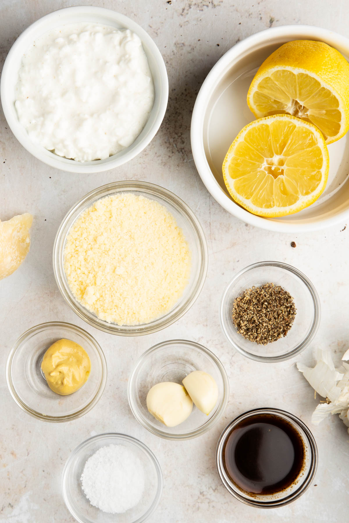 cottage cheese caesar salad dressing ingredients on a stone background
