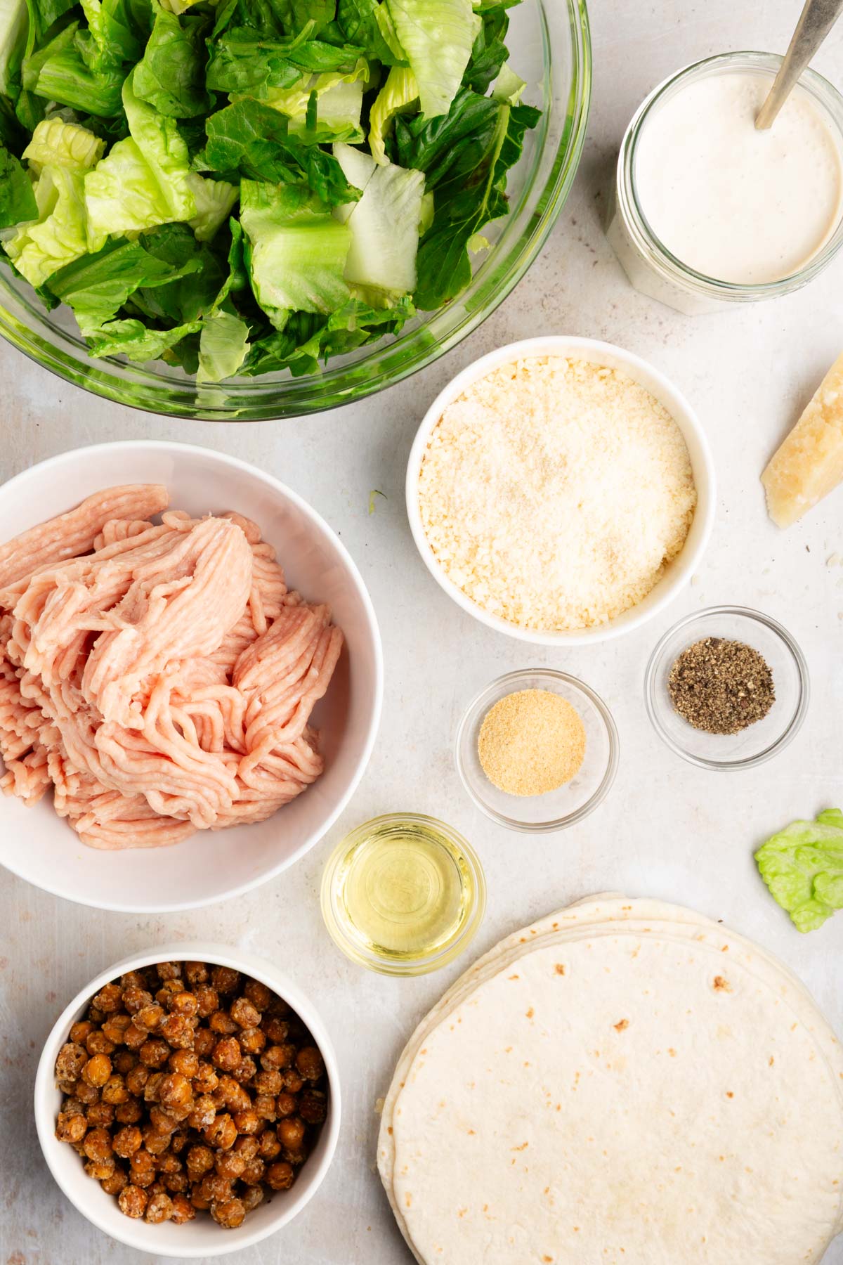 overhead photo of ingredients for smashed chicken caesar tacos